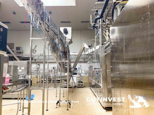 Aseptic line for blowing and packaging PET bottles