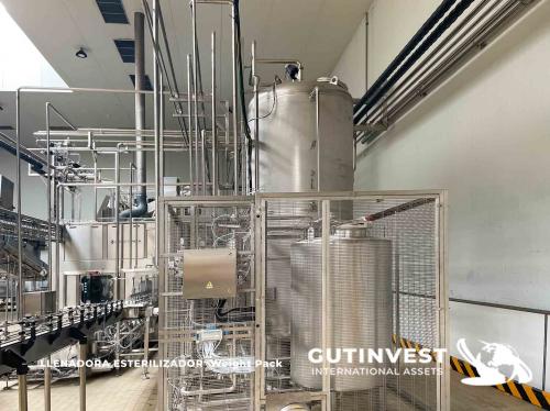 Aseptic line for blowing and packaging PET bottles