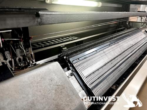 Textile flat knitting machine