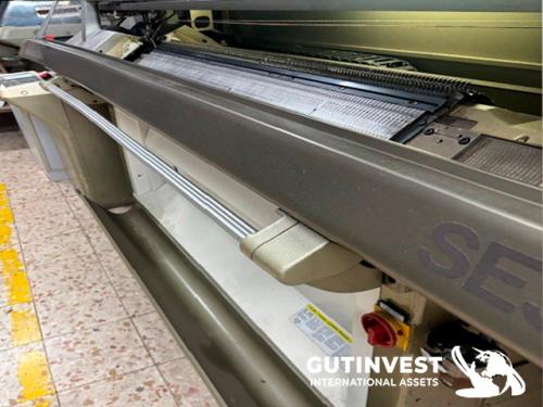 Textile flat knitting machine