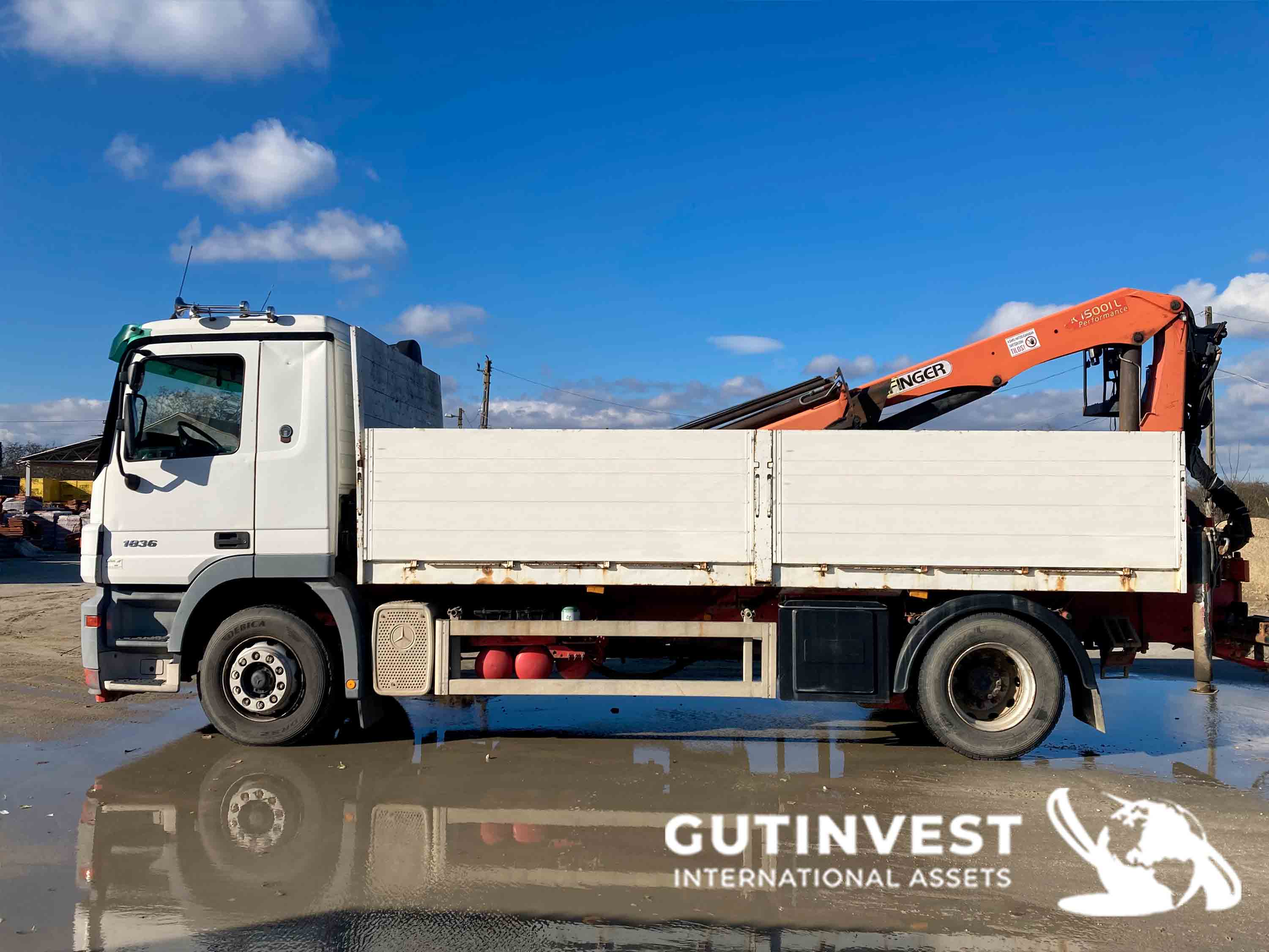 Truck with open box and crane